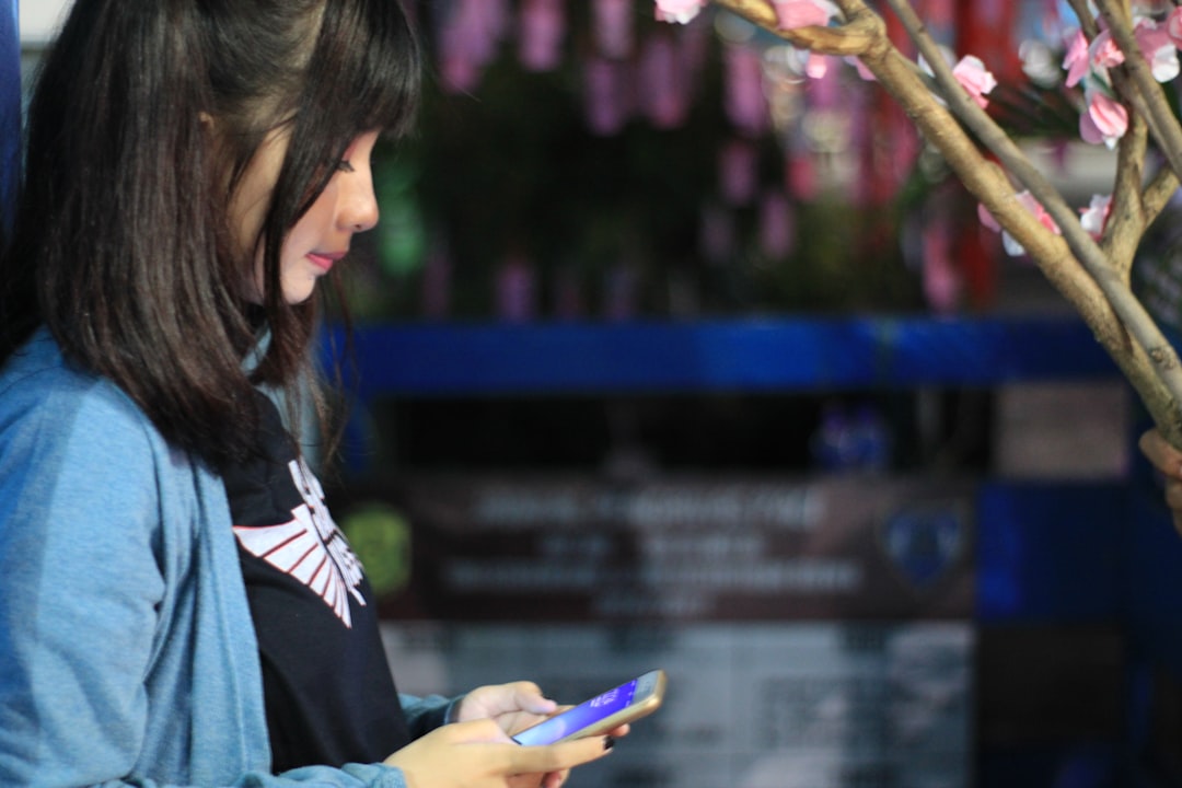 Asian shopper using mobile commerce app